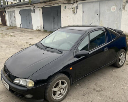 Черный Опель Тигра, объемом двигателя 1.4 л и пробегом 230 тыс. км за 2900 $, фото 1 на Automoto.ua