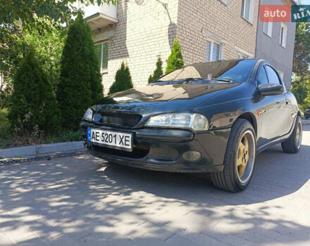 Чорний Опель Тігра, об'ємом двигуна 1.4 л та пробігом 229 тис. км за 3300 $, фото 1 на Automoto.ua