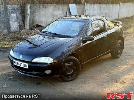 Черный Опель Тигра, объемом двигателя 1.4 л и пробегом 444 тыс. км за 1375 $, фото 1 на Automoto.ua