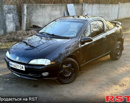 Черный Опель Тигра, объемом двигателя 1.4 л и пробегом 444 тыс. км за 1375 $, фото 1 на Automoto.ua