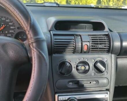 Коричневый Опель Тигра, объемом двигателя 1.39 л и пробегом 194 тыс. км за 1500 $, фото 11 на Automoto.ua