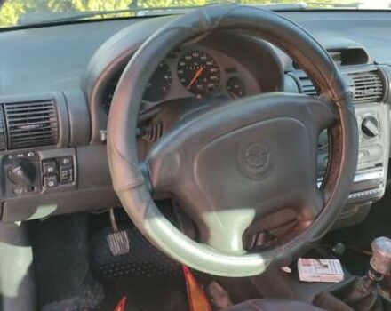 Коричневый Опель Тигра, объемом двигателя 1.39 л и пробегом 194 тыс. км за 1500 $, фото 2 на Automoto.ua