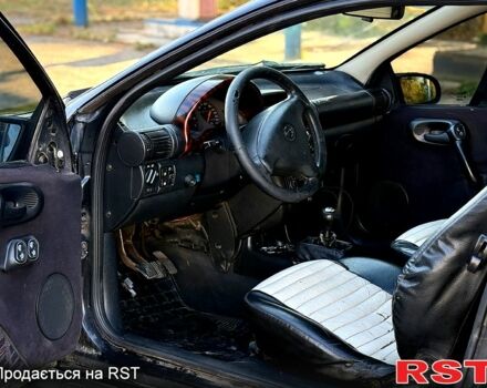 Опель Тигра, объемом двигателя 1.4 л и пробегом 222 тыс. км за 1650 $, фото 12 на Automoto.ua