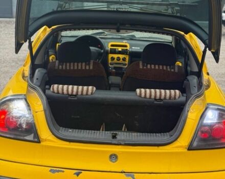 Желтый Опель Тигра, объемом двигателя 1.4 л и пробегом 180 тыс. км за 1350 $, фото 9 на Automoto.ua