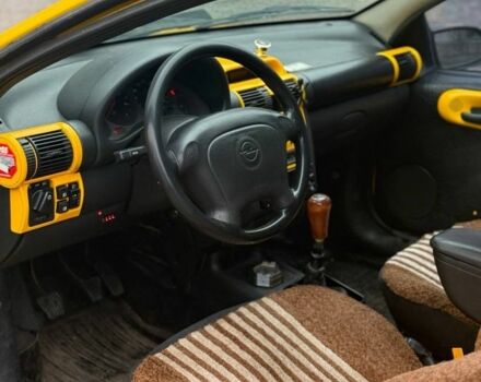 Желтый Опель Тигра, объемом двигателя 1.4 л и пробегом 180 тыс. км за 1350 $, фото 6 на Automoto.ua