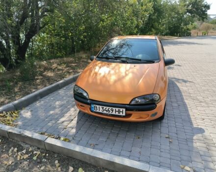 Желтый Опель Тигра, объемом двигателя 1.4 л и пробегом 180 тыс. км за 1800 $, фото 1 на Automoto.ua