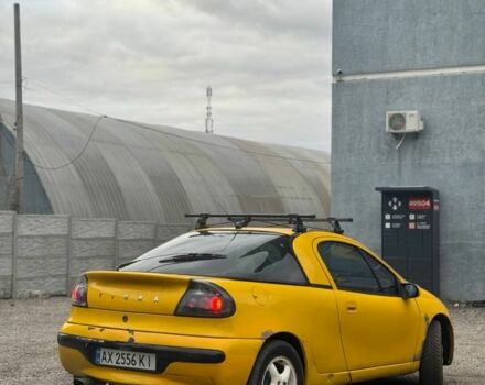 Желтый Опель Тигра, объемом двигателя 1.4 л и пробегом 180 тыс. км за 1350 $, фото 2 на Automoto.ua