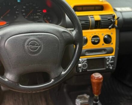 Желтый Опель Тигра, объемом двигателя 1.4 л и пробегом 180 тыс. км за 1350 $, фото 7 на Automoto.ua