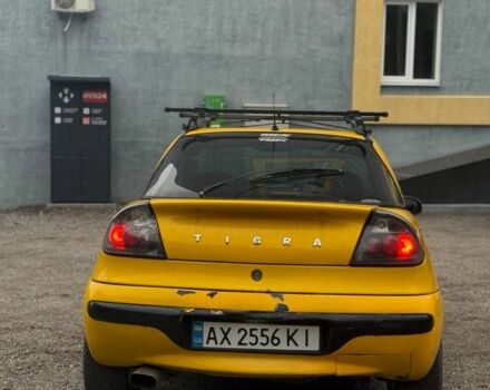 Желтый Опель Тигра, объемом двигателя 1.4 л и пробегом 180 тыс. км за 1350 $, фото 3 на Automoto.ua