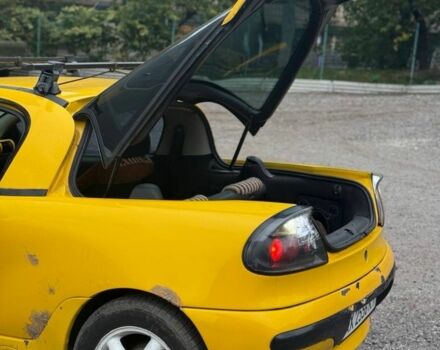 Желтый Опель Тигра, объемом двигателя 1.4 л и пробегом 180 тыс. км за 1350 $, фото 8 на Automoto.ua