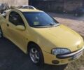 Желтый Опель Тигра, объемом двигателя 1.4 л и пробегом 204 тыс. км за 3500 $, фото 1 на Automoto.ua