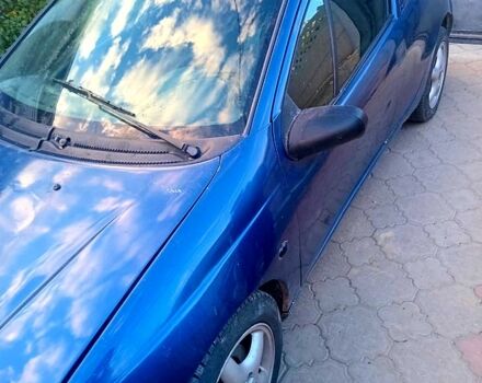 Синій Опель Тігра, об'ємом двигуна 1.4 л та пробігом 206 тис. км за 1400 $, фото 1 на Automoto.ua
