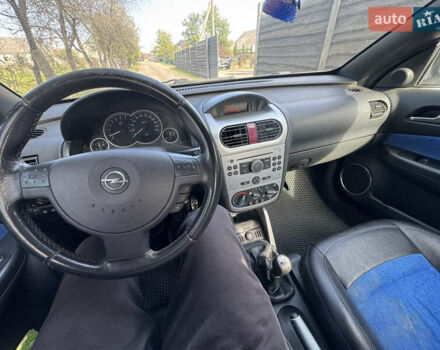 Синий Опель Тигра, объемом двигателя 1.39 л и пробегом 200 тыс. км за 4300 $, фото 27 на Automoto.ua