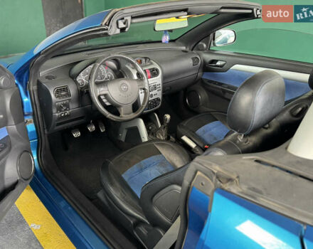 Синий Опель Тигра, объемом двигателя 1.39 л и пробегом 200 тыс. км за 4300 $, фото 20 на Automoto.ua