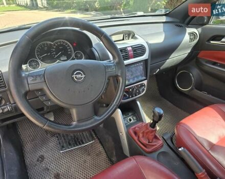 Синий Опель Тигра, объемом двигателя 1.36 л и пробегом 160 тыс. км за 3200 $, фото 11 на Automoto.ua