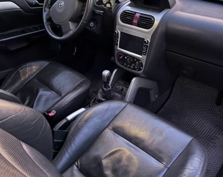 Синий Опель Тигра, объемом двигателя 1.4 л и пробегом 215 тыс. км за 4000 $, фото 4 на Automoto.ua