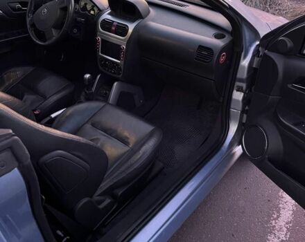 Синий Опель Тигра, объемом двигателя 1.4 л и пробегом 215 тыс. км за 4000 $, фото 5 на Automoto.ua