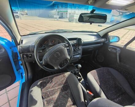 Синий Опель Тигра, объемом двигателя 1.4 л и пробегом 269 тыс. км за 2999 $, фото 7 на Automoto.ua