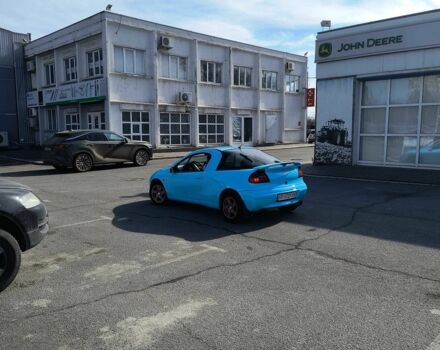 Синий Опель Тигра, объемом двигателя 1.4 л и пробегом 269 тыс. км за 2999 $, фото 12 на Automoto.ua