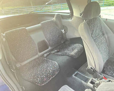 Синий Опель Тигра, объемом двигателя 1.4 л и пробегом 242 тыс. км за 3300 $, фото 4 на Automoto.ua