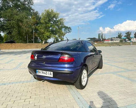 Синий Опель Тигра, объемом двигателя 1.4 л и пробегом 242 тыс. км за 3300 $, фото 1 на Automoto.ua