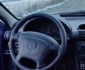 Синий Опель Тигра, объемом двигателя 1.39 л и пробегом 223 тыс. км за 2199 $, фото 9 на Automoto.ua
