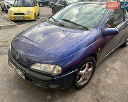 Синий Опель Тигра, объемом двигателя 1.6 л и пробегом 270 тыс. км за 1999 $, фото 1 на Automoto.ua