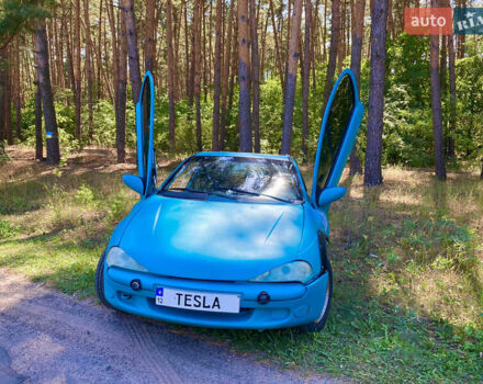 Синий Опель Тигра, объемом двигателя 1.6 л и пробегом 275 тыс. км за 4600 $, фото 1 на Automoto.ua