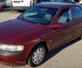 Красный Опель Вектра Б, объемом двигателя 1.6 л и пробегом 157 тыс. км за 1600 $, фото 1 на Automoto.ua