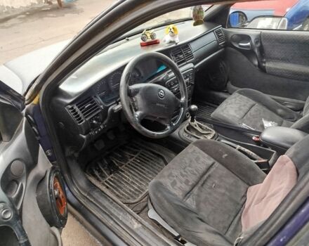 Черный Опель Вектра, объемом двигателя 2 л и пробегом 330 тыс. км за 600 $, фото 6 на Automoto.ua