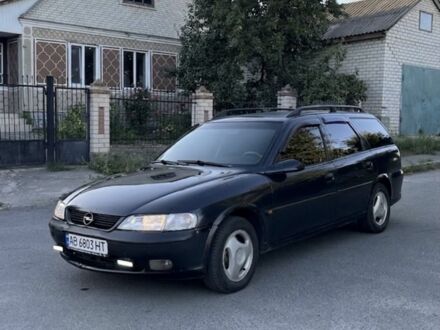Черный Опель Вектра, объемом двигателя 1.6 л и пробегом 310 тыс. км за 897 $, фото 1 на Automoto.ua