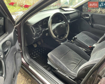 Фиолетовый Опель Вектра, объемом двигателя 1.6 л и пробегом 65 тыс. км за 2800 $, фото 18 на Automoto.ua