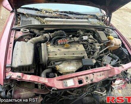 Красный Опель Вектра, объемом двигателя 18 л и пробегом 380 тыс. км за 1150 $, фото 4 на Automoto.ua