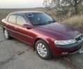 Красный Опель Вектра, объемом двигателя 1.6 л и пробегом 400 тыс. км за 1500 $, фото 1 на Automoto.ua