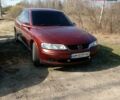 Красный Опель Вектра, объемом двигателя 1.8 л и пробегом 302 тыс. км за 3200 $, фото 1 на Automoto.ua