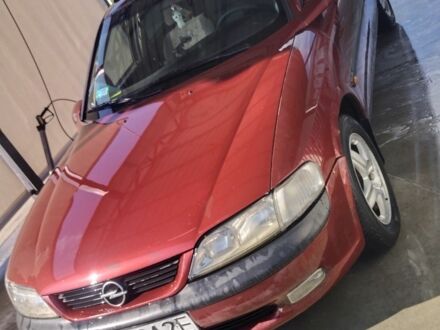 Красный Опель Вектра, объемом двигателя 2 л и пробегом 323 тыс. км за 1400 $, фото 1 на Automoto.ua
