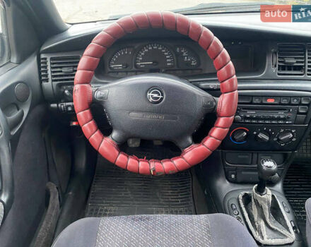 Синий Опель Вектра, объемом двигателя 1.8 л и пробегом 450 тыс. км за 1999 $, фото 24 на Automoto.ua