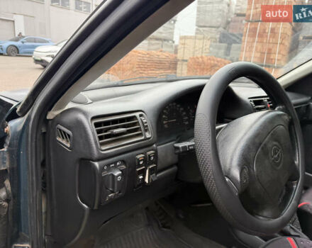 Зеленый Опель Вектра, объемом двигателя 2 л и пробегом 400 тыс. км за 1350 $, фото 10 на Automoto.ua