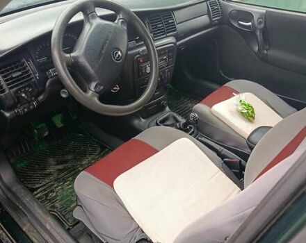 Зеленый Опель Вектра, объемом двигателя 2 л и пробегом 350 тыс. км за 3250 $, фото 3 на Automoto.ua