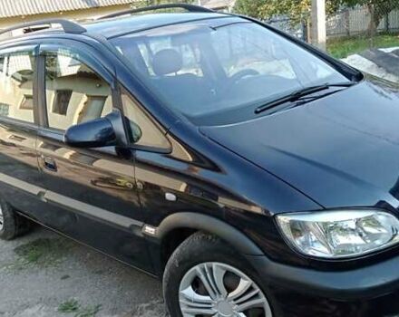 Синий Опель Зафира, объемом двигателя 2 л и пробегом 300 тыс. км за 4300 $, фото 1 на Automoto.ua