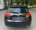 Черный Опель Insignia Sports Tourer, объемом двигателя 2 л и пробегом 173 тыс. км за 11450 $, фото 4 на Automoto.ua