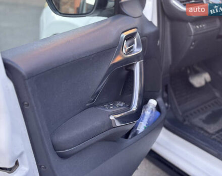 Белый Пежо 2008, объемом двигателя 1.56 л и пробегом 234 тыс. км за 11000 $, фото 17 на Automoto.ua