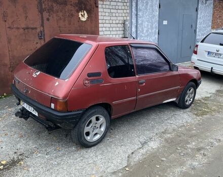 Красный Пежо 205, объемом двигателя 1.8 л и пробегом 200 тыс. км за 700 $, фото 1 на Automoto.ua