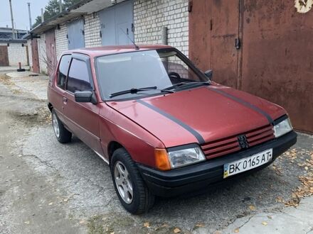 Красный Пежо 205, объемом двигателя 1.8 л и пробегом 200 тыс. км за 700 $, фото 1 на Automoto.ua