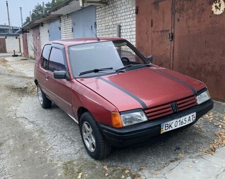 Красный Пежо 205, объемом двигателя 1.8 л и пробегом 200 тыс. км за 700 $, фото 1 на Automoto.ua