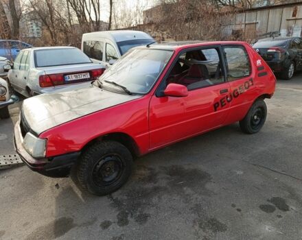 Красный Пежо 205, объемом двигателя 1.4 л и пробегом 100 тыс. км за 500 $, фото 1 на Automoto.ua