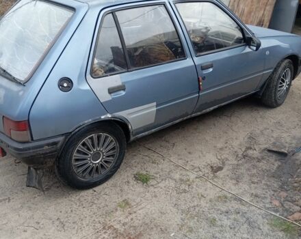 Серый Пежо 205, объемом двигателя 1.8 л и пробегом 250 тыс. км за 650 $, фото 3 на Automoto.ua