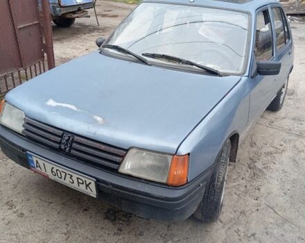 Серый Пежо 205, объемом двигателя 1.8 л и пробегом 250 тыс. км за 650 $, фото 1 на Automoto.ua