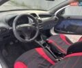 Белый Пежо 206, объемом двигателя 1.1 л и пробегом 265 тыс. км за 1699 $, фото 1 на Automoto.ua