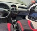 Белый Пежо 206, объемом двигателя 1.1 л и пробегом 265 тыс. км за 1699 $, фото 3 на Automoto.ua